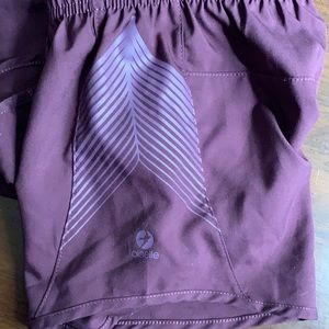 Oiselle size 6 maroon colored running shorts